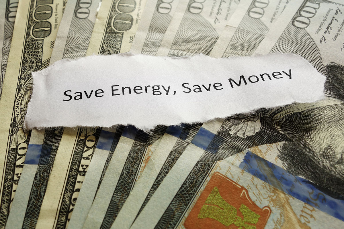 Stack of money with the words Save Energy, Save Money