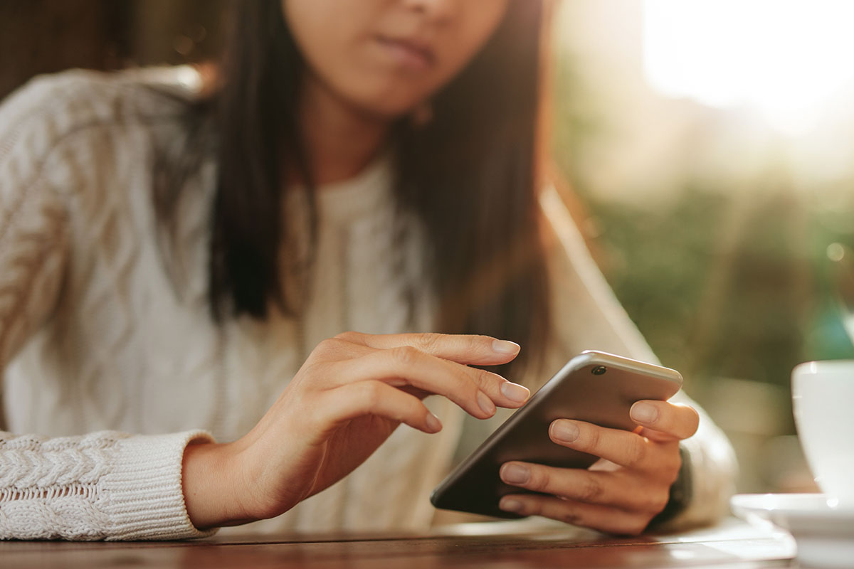 Young person texting on a cell phone