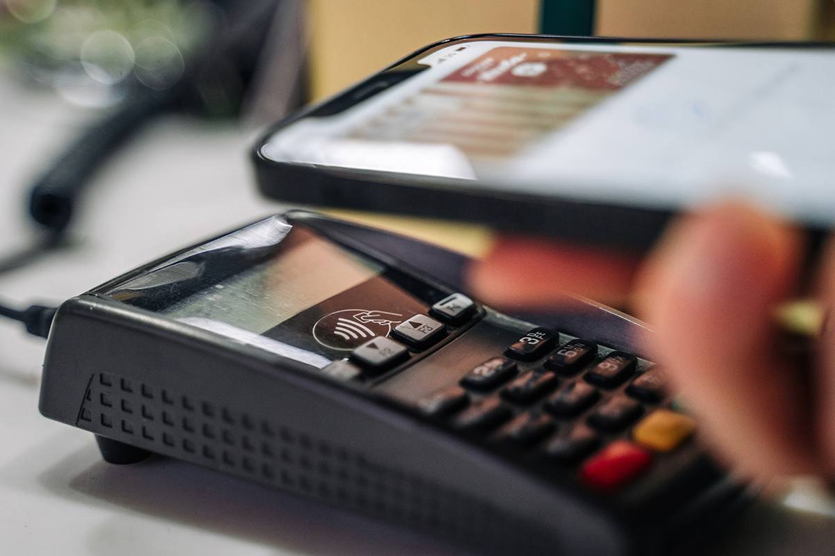 Person using a phone to make a purchase