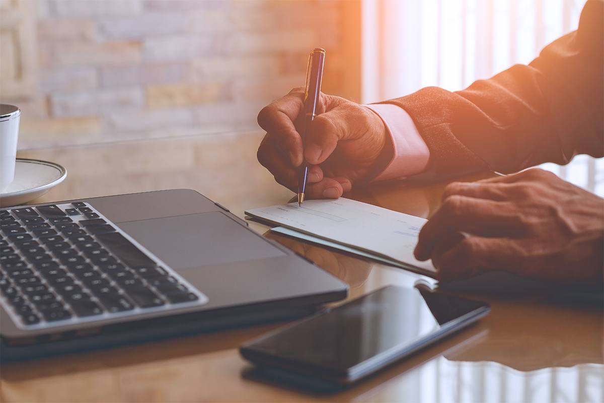 A person writing a check