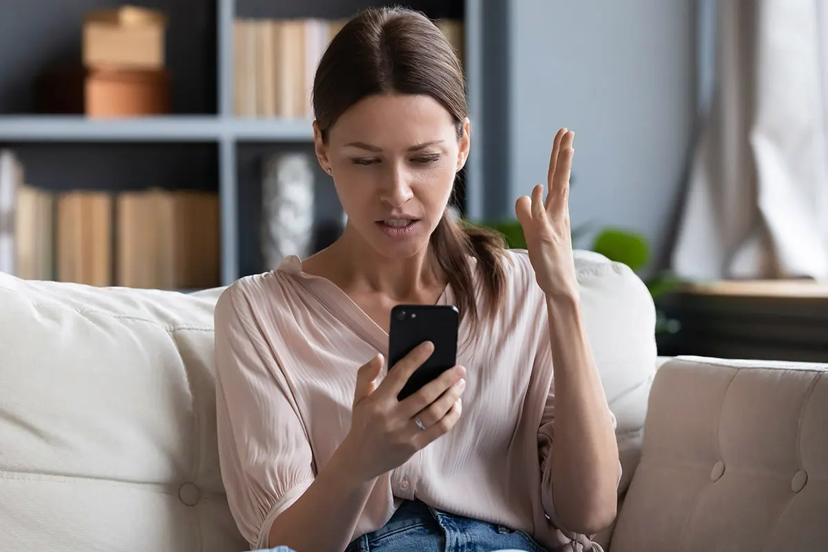 Woman on cell phone shocked at what she's seeing