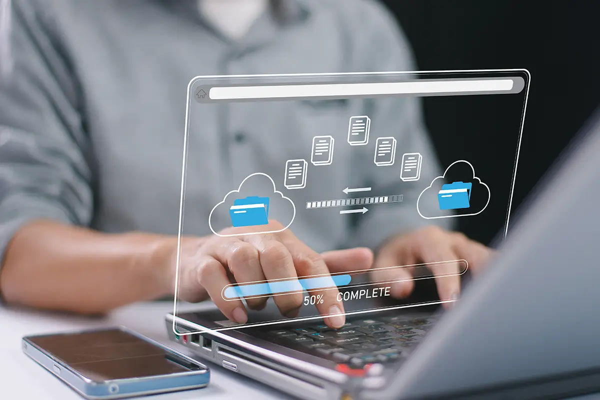 Person using computer utilizing a file transfer service