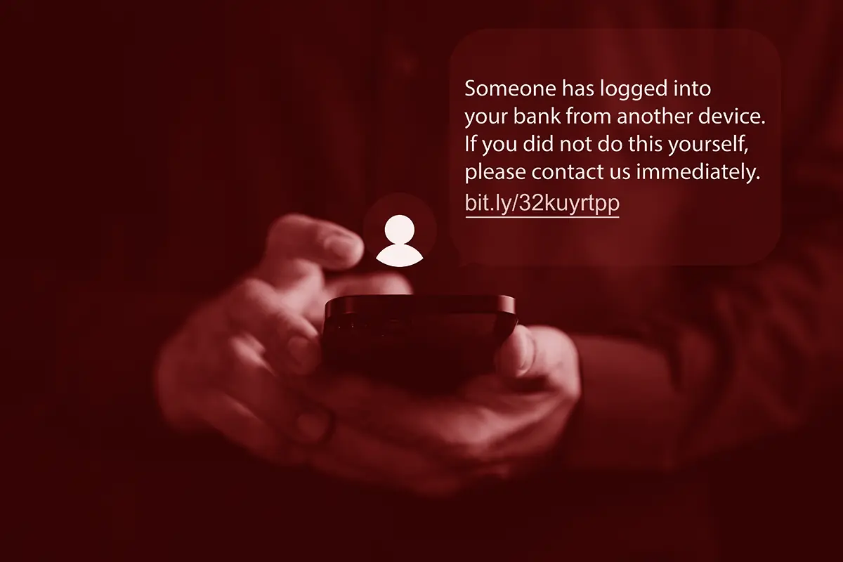 Person using phone receiving a scam text message